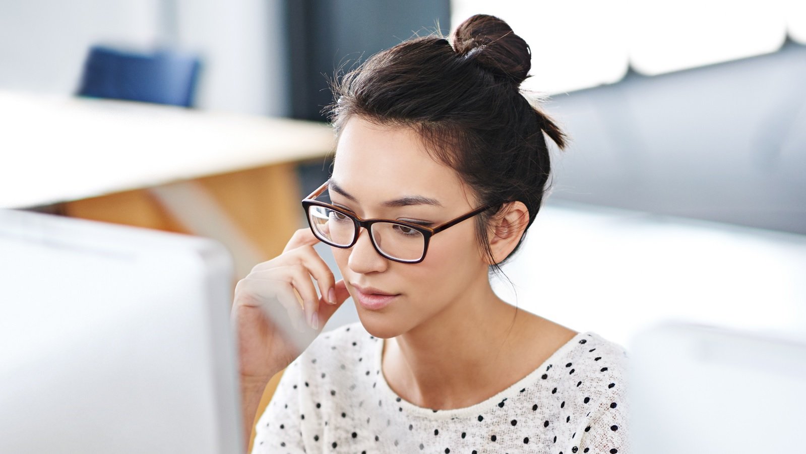 woman working with her phone and laptop