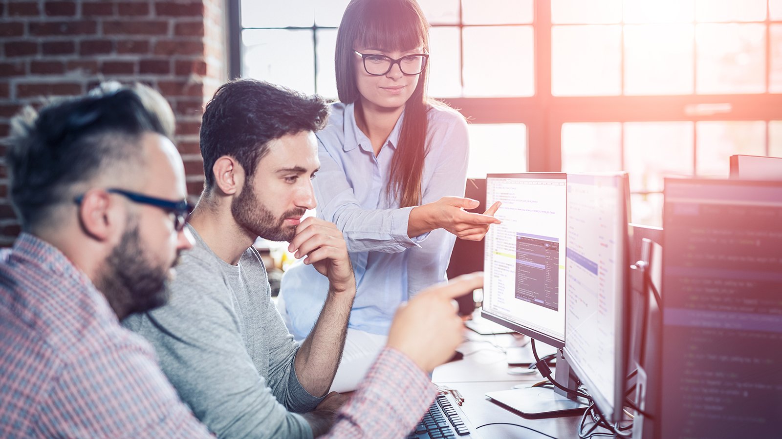 Group of people working on a computer