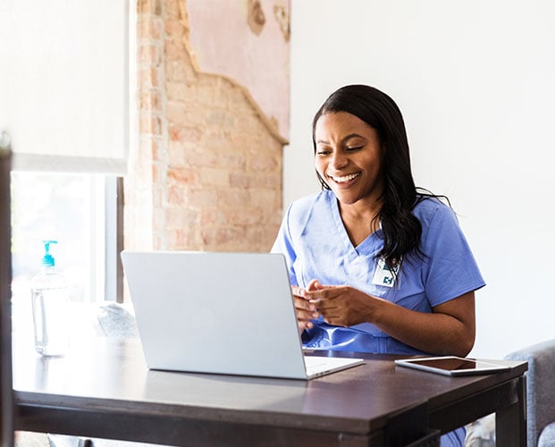 Happy woman working on laptop