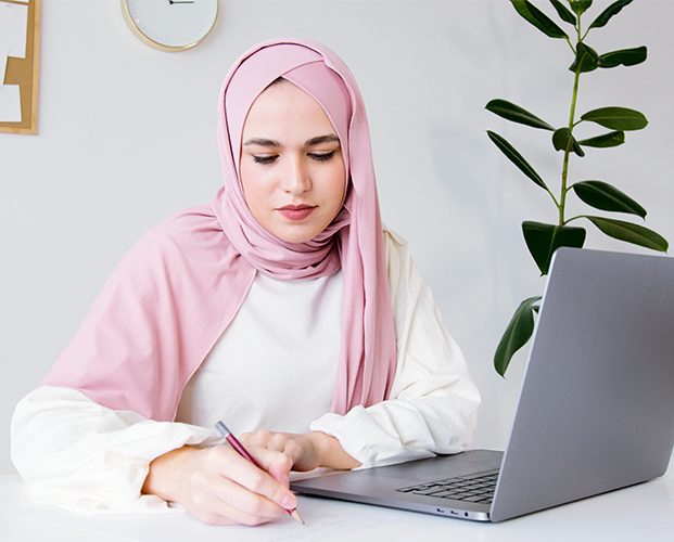 Muslim business woman in hijab sitting at modern office