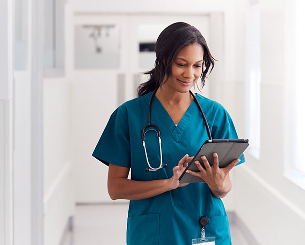 Young woman health worker working on tablet