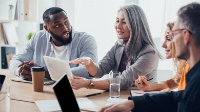 Group of young business people are working together in modern office