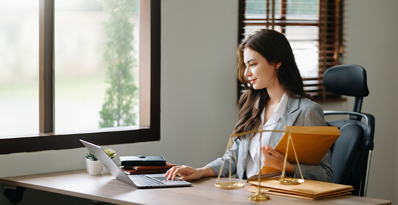 beautiful-woman-lawyer-working-on-laptop