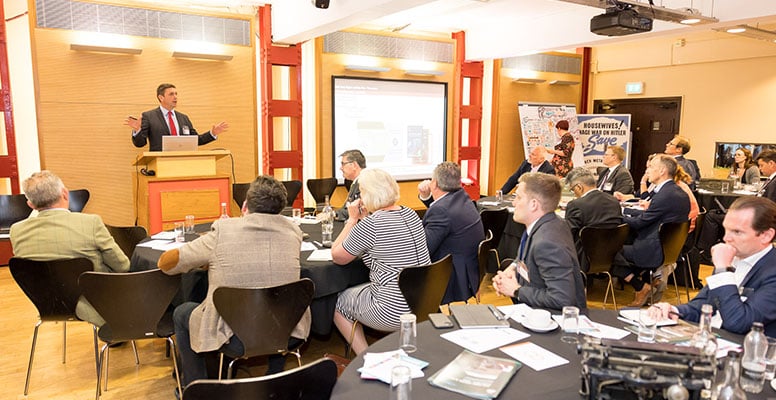 Businessman giving a lecture to a group 