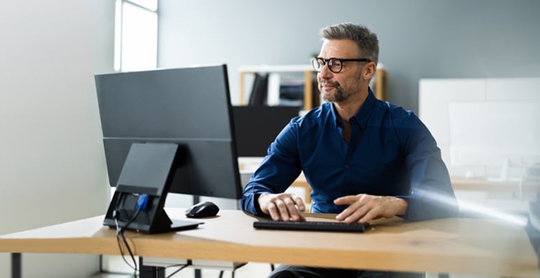 Businessman Using Business Computer In Office Or Workplace