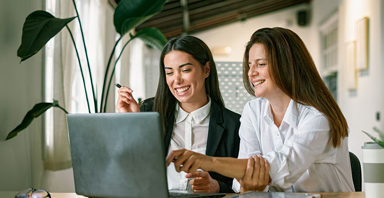 Female employees working on project together