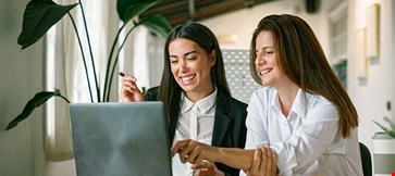 Female employees working on project together