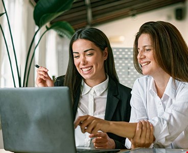 Female employees working on project together