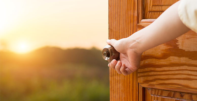 grand-opening-women-hand-open-door