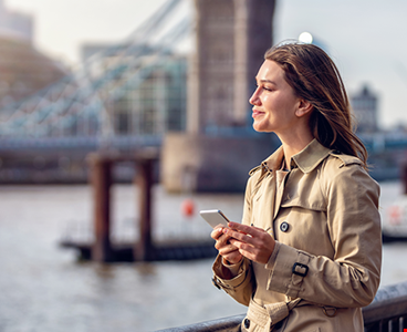 portrait-trendy-business-woman-holding-mobile