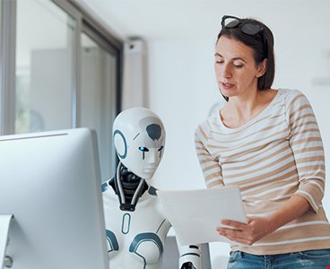 Woman AI robot working together office