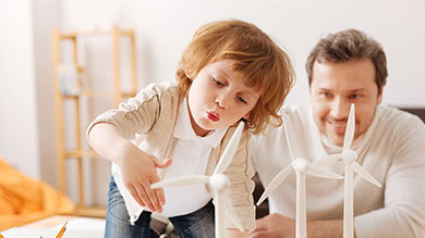 Positive delighted man looking  his son