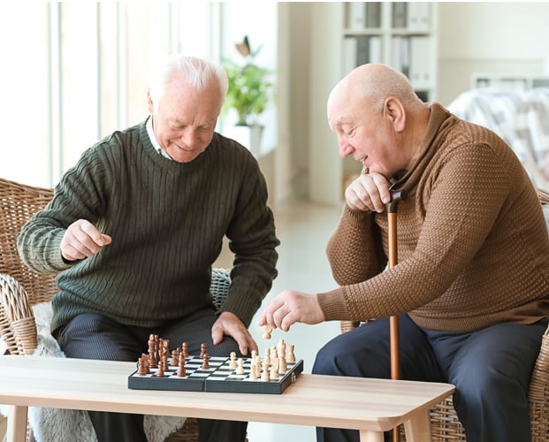 Senior men playing chess