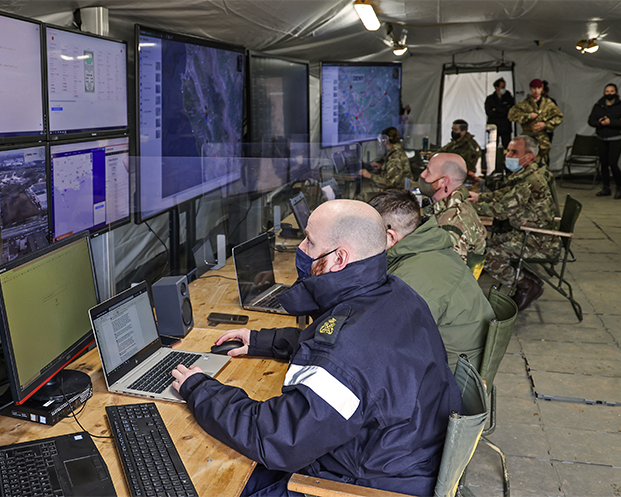 Soldiers working on laptop