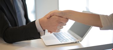 Handshake image of two business partners