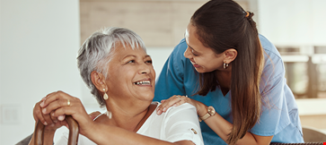 Care taker and woman smiling