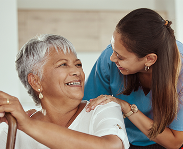 Care taker and woman smiling