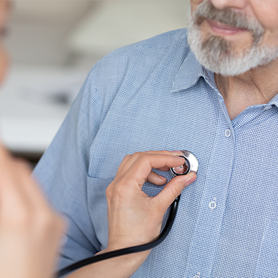 Doctor holds stethoscope listen to male patient heartbeat